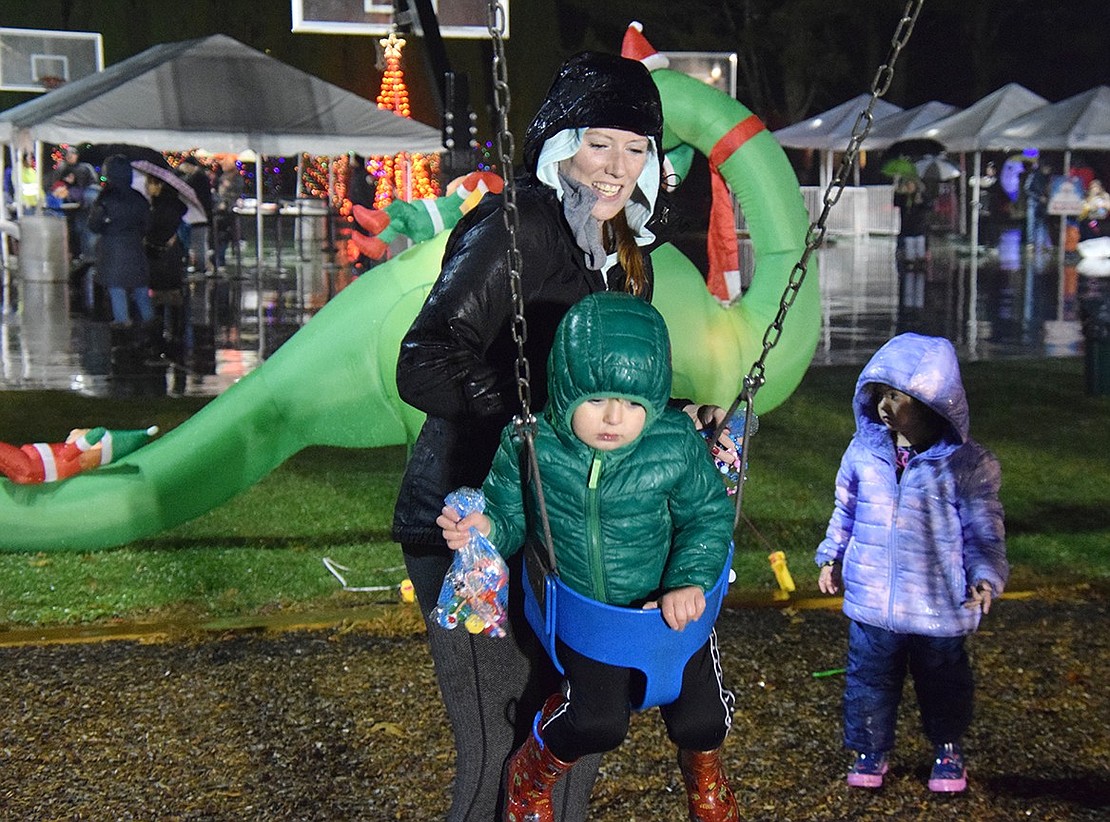 Rye Brook resident Julie Valad gives her 2-year-old son Anderson a push on the swing.