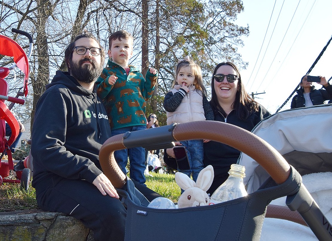 The Giannantonio family of Port Chester finds a good spot to sit on the corner of Putnam Avenue and King Street, giving them a perfect view of the parade. From the left: Dan, 3-year-old Booker, 2-year-old Winnie and Ann.