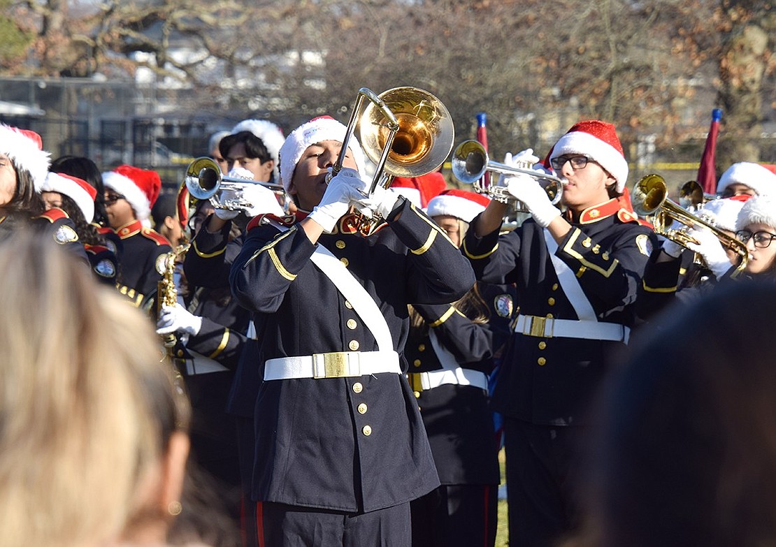 Pride of Port Chester trombonist José De Paz, a junior, steps out from the line to wow the crowd at Lyon Park with a solo.