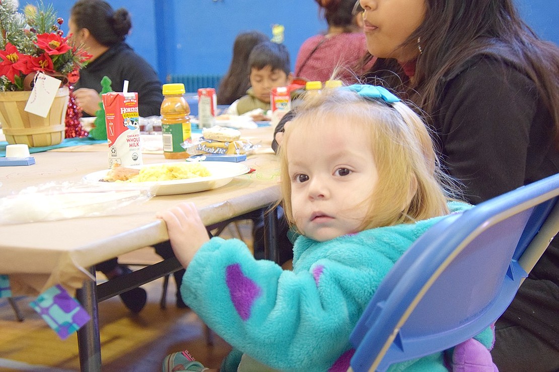 Curious 1-year-old Giselle Martinez of Port Chester takes a look around the community center.