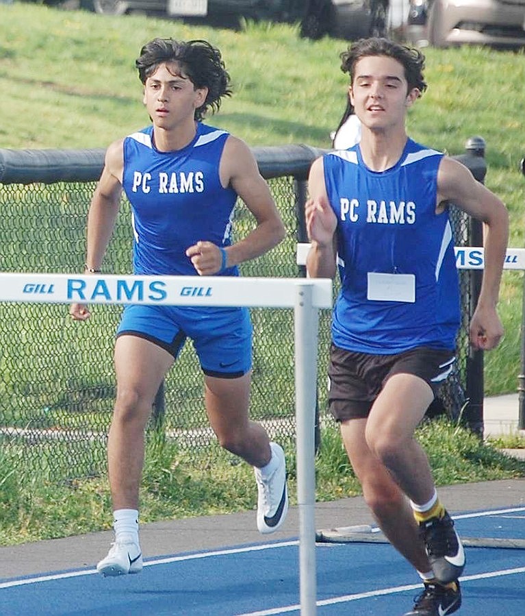 John Delcid (left) is a senior Track & Field team captain who specializes in hurdles and sprints. He is also a team motivator.