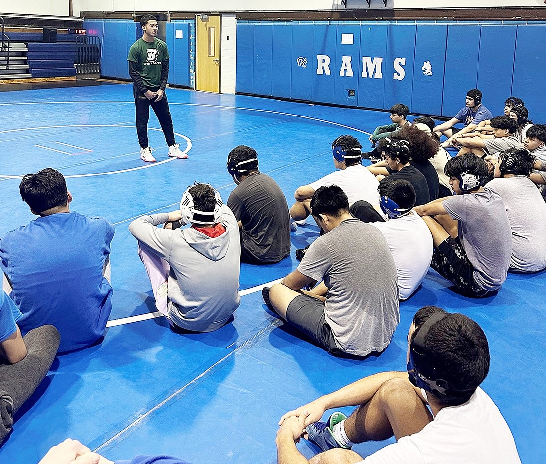 Visiting legend Ivan Garcia gives the Port Chester High School wrestling team an inspirational talk during one of their winter break practices. The All-State lightweight who wrestled for the Rams is currently a SUNY Binghampton wrestling star.