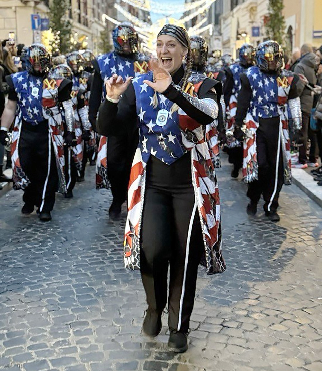 Madeline Rende, the assistant director of the Saints Brigade Drum and Bugle Corps, leads musicians down the streets of Rome, Italy. The Saints Brigade participated in the Rome New Year’s Day Parade on Jan. 1, representing both the United States’ and Port Chester’s marching band communities.