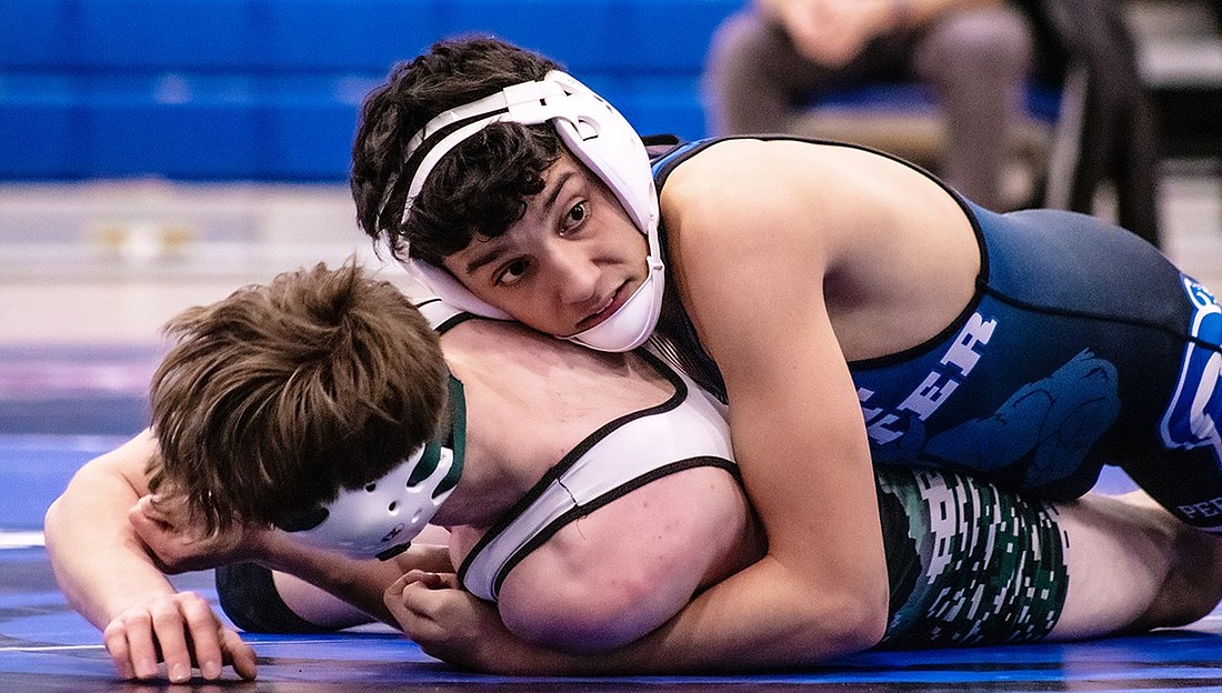 Port Chester junior Nichola Pereira causes his Pleasantville opponent to fall during a home match last Wednesday (1/10).