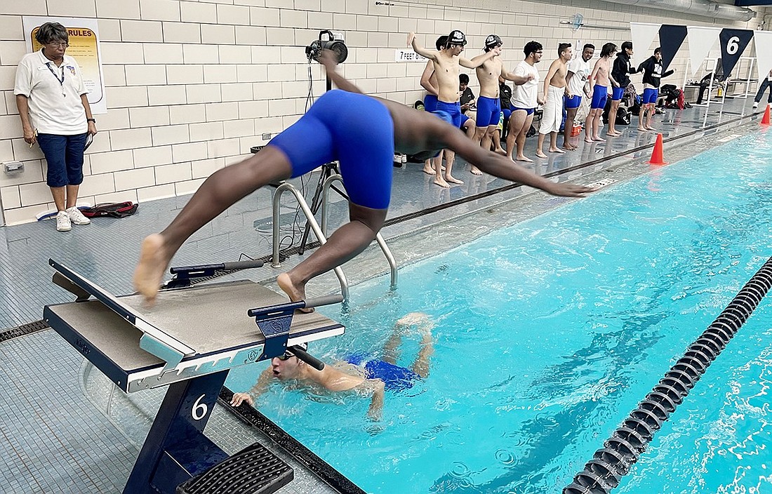 Freshman Hayden Anti, an experienced swimmer who just joined the Rams swim team, dives in for his leg of the freestyle relay while Andrew Tapia finishes his in an away meet against Mount Vernon/Tuckahoe on Thursday, Jan. 11.