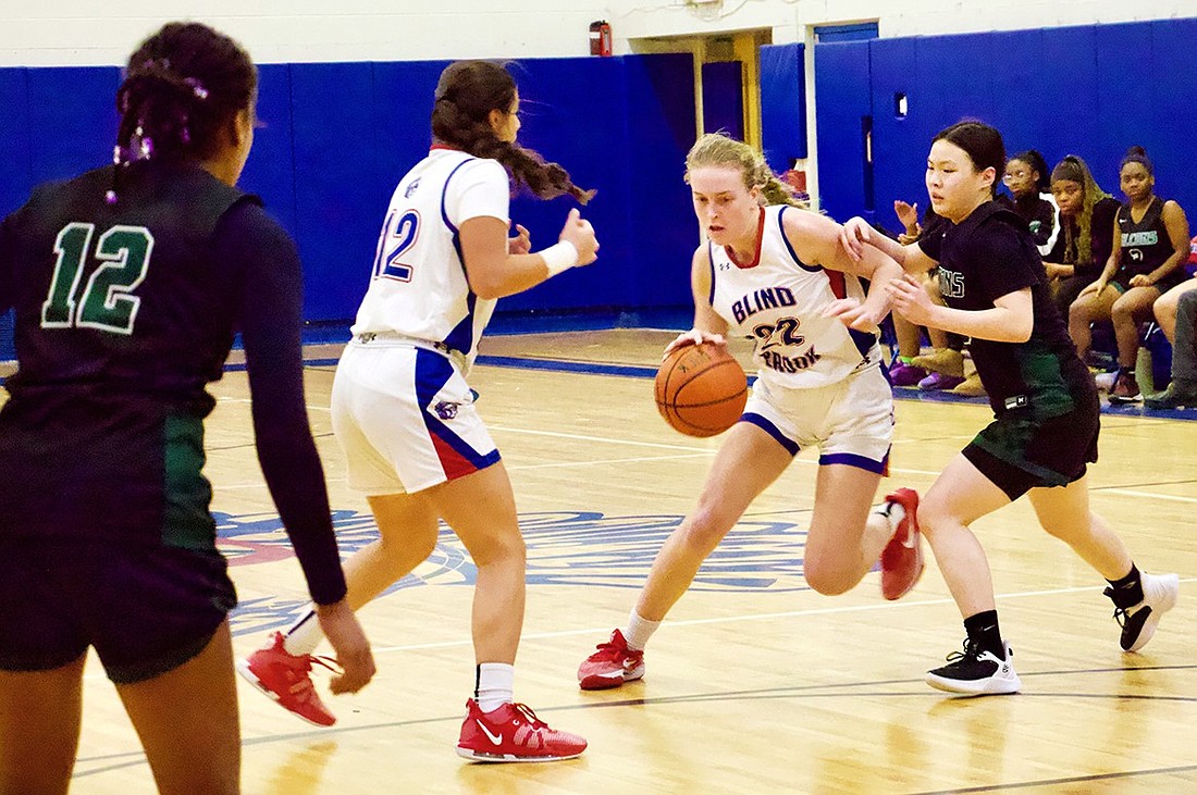 Blind Brook sophomore Kendall Konigsberg dribbles out of pressure during the Trojans’ 57-56 loss to Woodlands High School on Tuesday, Jan. 23. Konigsberg has been Blind Brook’s leading scorer in every game so far this season.