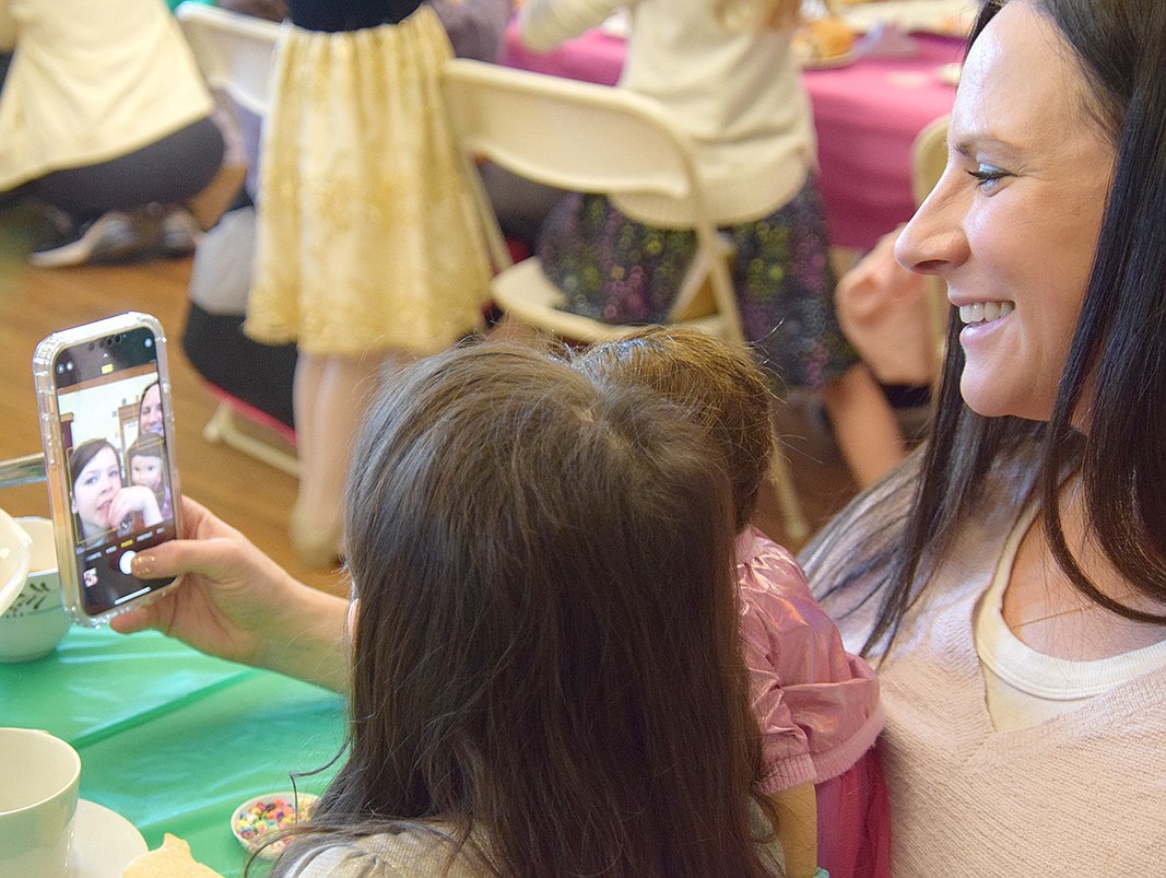 Sunset Road resident Sarah Gillespie takes a selfie with her 5-year-old daughter Naomi and her doll Leila.