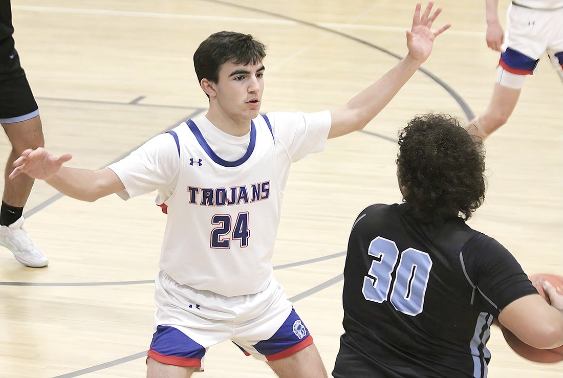 Nicolas Palacios blocks a Rye Neck player from passing the ball in last Friday’s 62-48 home victory over the Panthers.