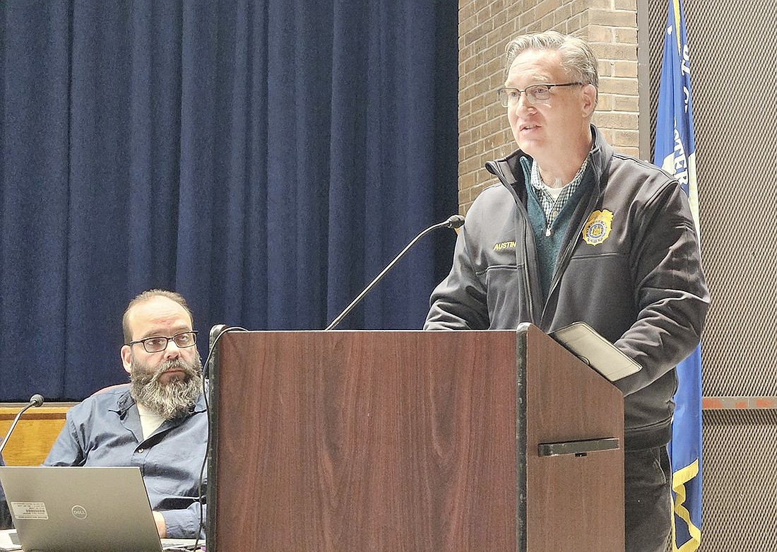 Rye Brook Police Chief Greg Ausitn speaks to the Port Chester Board of Education, including Trustee Rob Dominguez (left), about the work the SRO (School Resource Officer) committee put into developing goals for the program, which he helped craft. The school board approved the initiative later that night during their meeting on Thursday, Jan. 18.