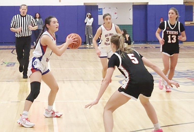 Kyra Mak fakes out an opponent to help get the ball closer to the basket in the Lady Trojans’ Homecoming game against Croton-Harmon on Friday, Jan. 26.