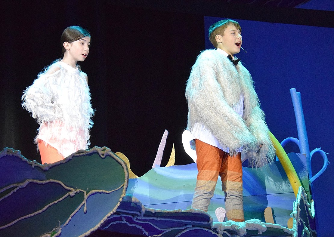 Nigel the fish-friendly seagull (right, played by Luke Pallotta) and his companion (played by Harper Hirsch) let their friends in the fishtank know that Marlin is nearby.