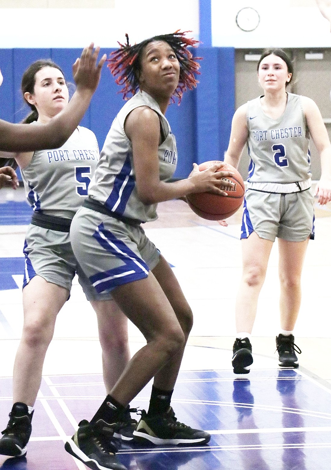 Heavily guarded junior Elise Thomas looks to shoot a basket in Monday’s home game against Clarkstown North. The Lady Rams lost that contest 43-28.