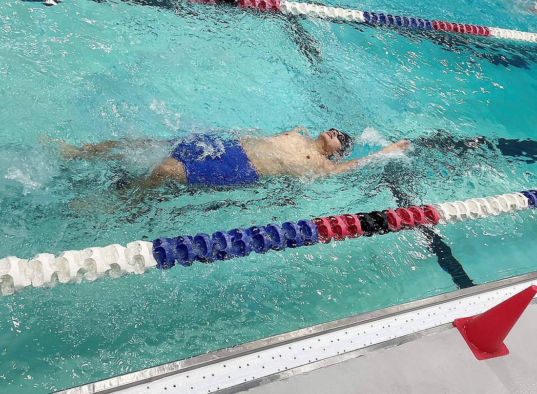 Kevin Pintado competes in the 100-Yard Backstroke at the Conference Championships Saturday (1/27) at the Mark Twain Pool in Mt. Vernon.