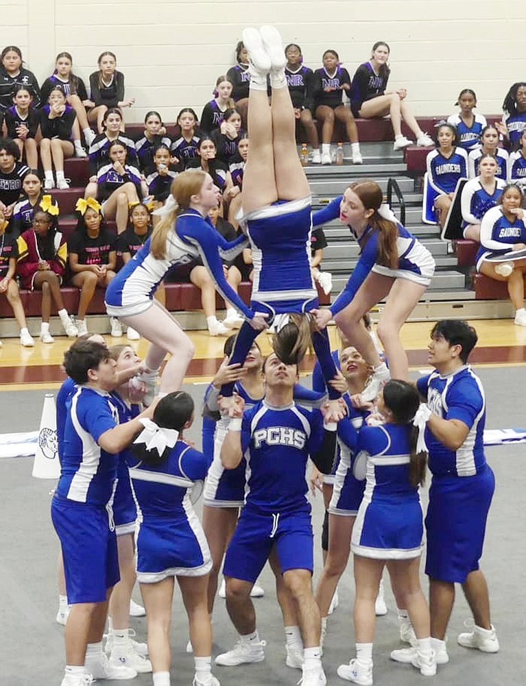 One of the stunts performed by the Port Chester High School varsity cheerleaders during a competition.