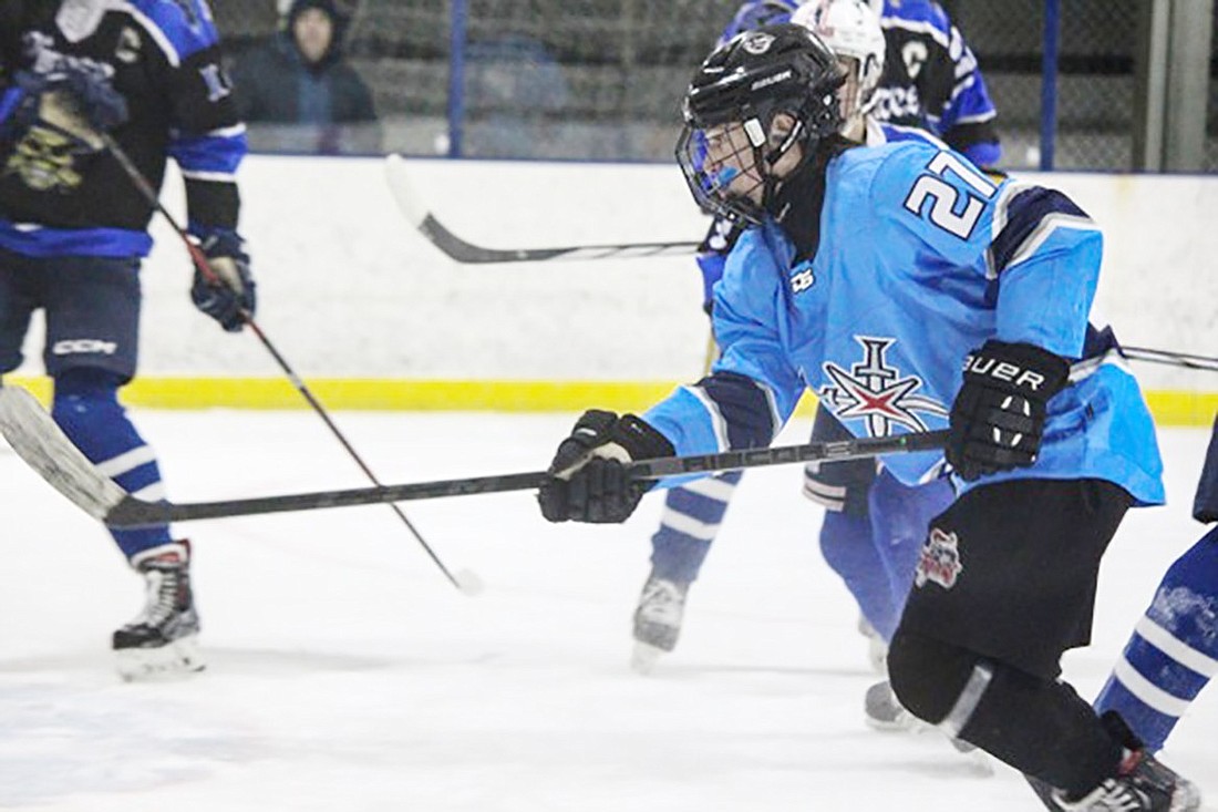 Rye Town-Harrison Titans player Noah Lowenthal (Blind Brook sophomore) makes his way toward the goal against Pearl River on Sunday, Jan. 21 at Ebersole Ice Rink in White Plains.