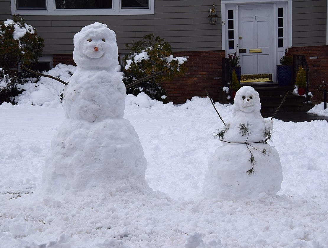 Carefully crafted snow figures stand in the front yard at 8 Hunter Dr.