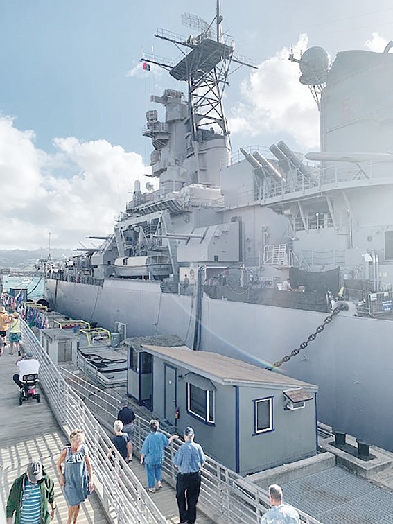 The battleship Missouri at its permanent anchor site in Pearl Harbor where it is now a major tourist attraction.