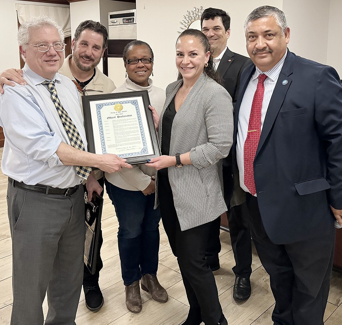 Village board members present retiring Village Attorney Anthony Cerreto a proclamation from the Village of Port Chester at his retirement dinner at T&J Pizza and Pasta on Thursday, Feb. 22. They also gave him an impressive plaque with a key to the village. From left, Cerreto, Trustees Phil Dorazio, Joan Grangenois-Thomas, Juliana Alzate and John Allen and Mayor Luis Marino.