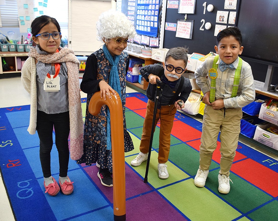 With canes, wigs and a Life Alert badge, first-graders in Lidette Hernandez’s dual language class at King Street Elementary School went all out to celebrate the 100th day of school by dressing up like centenarians. Diana Samano (left), Danna Mendez, Julian Ochoa and Cristofer Monge were just a few of many across the Port Chester School District recognizing the milestone with activities involving the number 100.