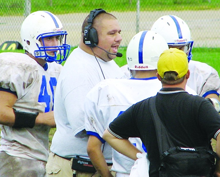 Port Chester Rams head football coach Greg Domestico motivates his players during a game back in 2009 when he was named League Coach of the Year. The Port Chester High School alumnus is back to coach Track & Field for the spring season.