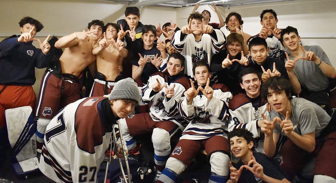 The Rye Town-Harrison Titans celebrate following their victory over Cortlandt in the second round of the playoffs on Tuesday, Feb. 20 at Playland Ice Casino in Rye.