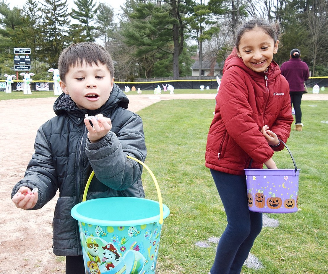 Ridge Street Elementary School first-grader Evan Harmon (left) makes his distaste for “purple-flavored” candy known. His friend and classmate Arya Agrawal has a laugh at his expense.