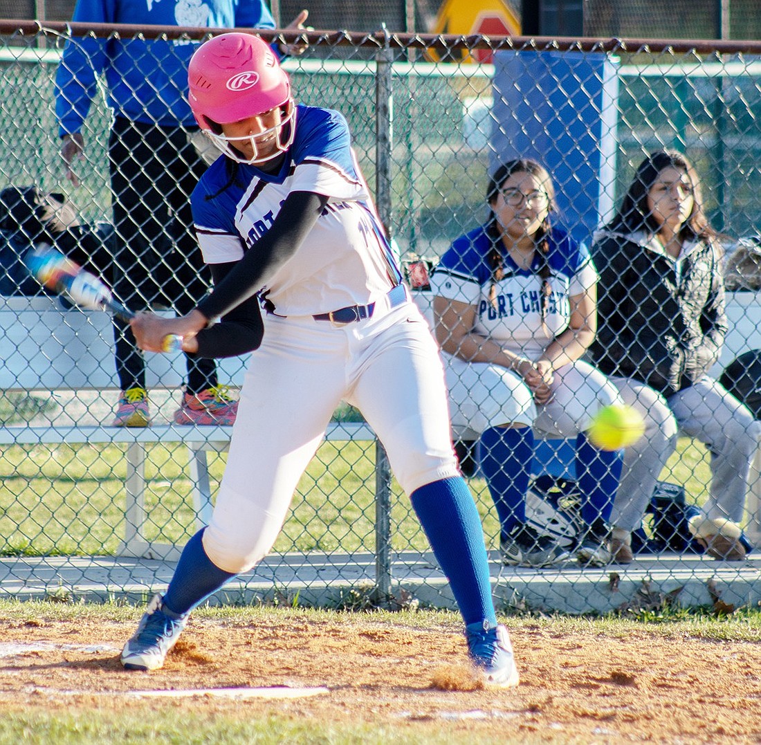 Port Chester first baseman Tamara Correia hits with the ball and sends it into right field during the Lady Rams’ softball game against East Ramapo at home on Monday, Mar. 25. The Lady Rams ran away with that game 19-7.