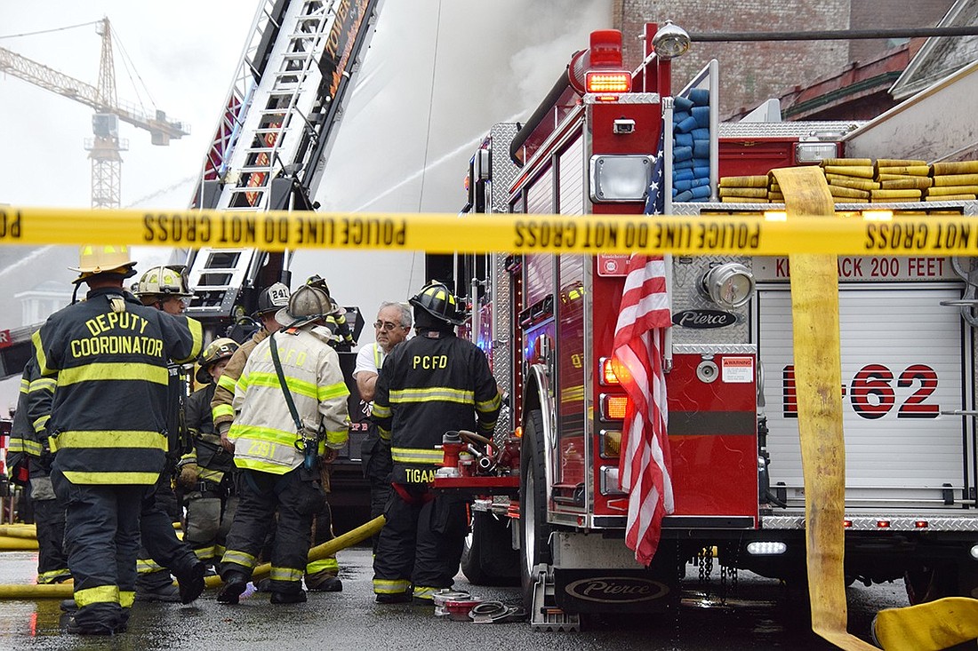 Members of the Port Chester Fire Department work during a fire on South Main Street in April 2023. After 52 years, the Occupational Safety and Health Administration (OSHA) has recommended significant changes to its fire service standards. The proposed alterations have sparked significant backlash from firefighter associations across the nation.