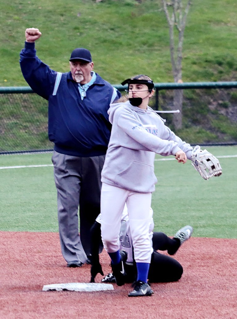 Sophia Morlino throws to first after recording an out at second base in hopes of making a double play in last Thursday’s (4/11) home loss to The Leffell School in rainy weather.