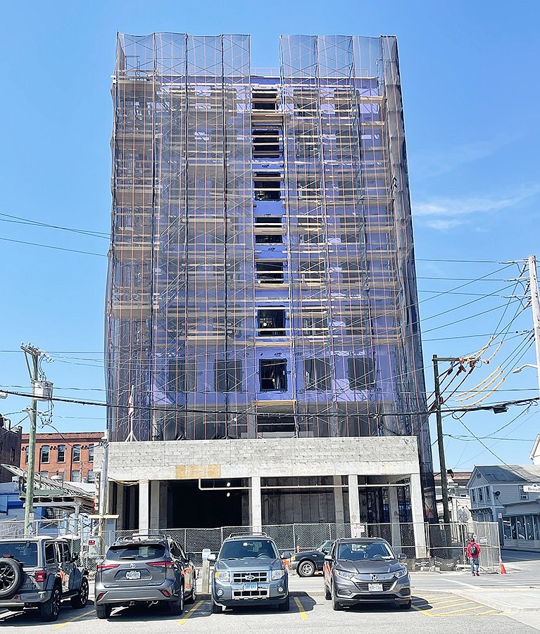 The 9-story structure at 30 Broad St., as seen from the Metro-North commuter lot across the street, has reached its planned height. However, construction has stopped due to a discrepancy in the approved plans for the building compared to what was built, according to the Village of Port Chester.