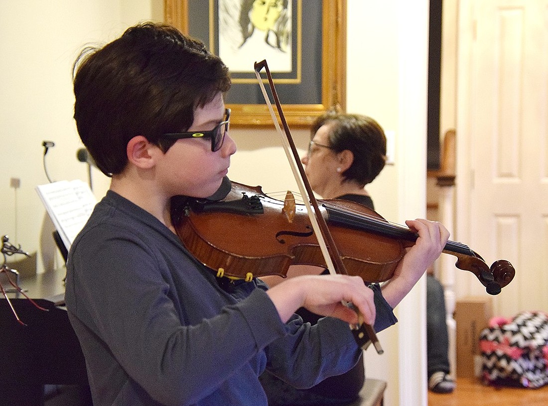 Accompanied by his grandmother Irina Lutinger on the piano, Rye Brook 8-year-old Jacob Koyfman performs “Introduction and Polonaise” by Carl Bohm on Tuesday, Apr. 23. The Ridge Street Elementary School student is preparing to play the same piece at Carnegie Hall on Tuesday, Apr. 30.