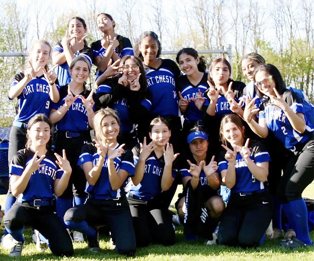 The Port Chester High School varsity softball team members give the victory sign after beating Lincoln on Apr. 19 and Apr. 24. They are: Front row from left: Morgan Saunders, Melina Morban, Yvonne Santiago, Taby Sanchez, Karah Provenzano. Middle row, from left: Kathleen Scarola, Fiona Lovallo, Marisa Rodriguez, Tamara Correia, Fatima Coyt, Isabella Rivera, Skylar Sams, Kimberly Ventura. Back row, from left: Sofia Greco, Heidi Gonzalez.