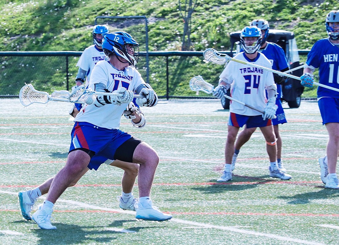 Tyler Taerstein takes a shot on goal against Hendrick Hudson at home on Friday, May 3. He had one goal and one assist in the Trojans’ 11-5 loss.