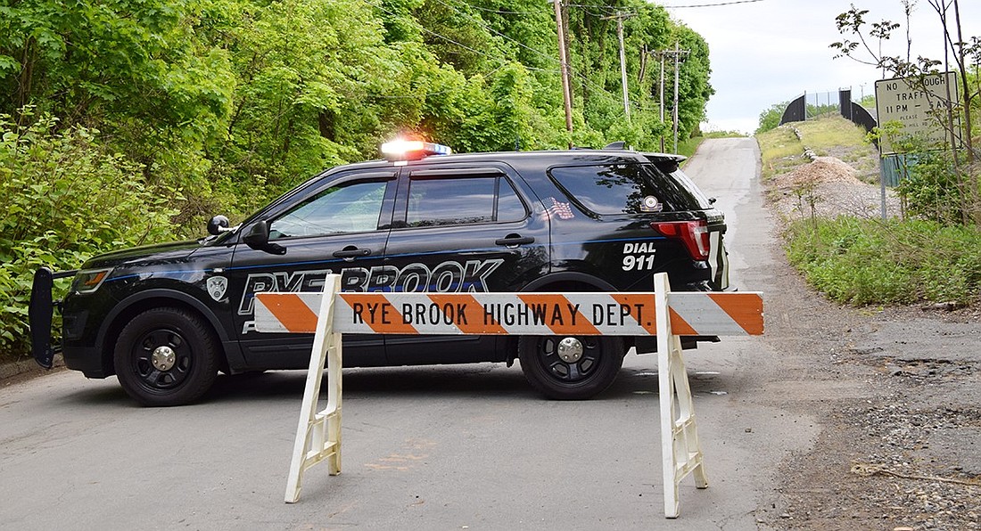 A Rye Brook police cruiser blocks off upper Lincoln Avenue, bordering the Westchester County Airport, on Thursday, May 9. The street was cordoned off to allow for the filming of an upcoming Netflix miniseries starring Robert De Niro titled “Zero Day,” which also brought the actor to two other locations on King Street.