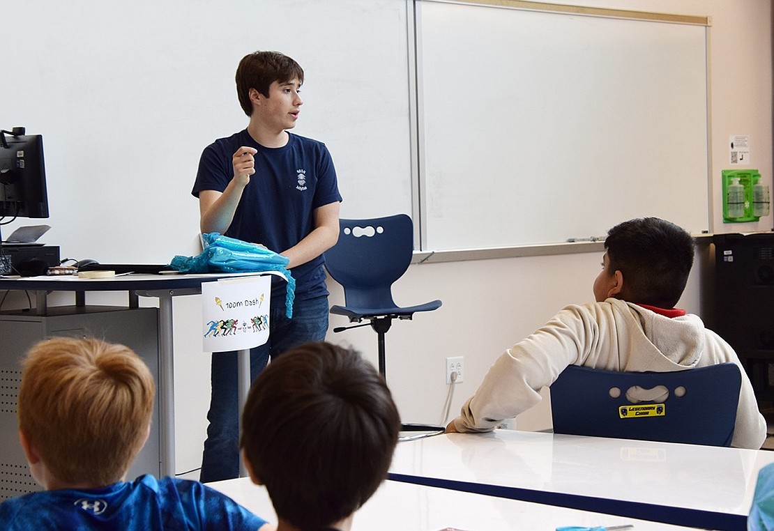 Alex Thompson, a Blind Brook senior who serves as the team’s PR officer and runs the Junior Jellies program, relays instructions to the two dozen elementary schoolers in attendance. Thompson is credited by recent robotics club graduates for updating the Junior Jellies curriculum.