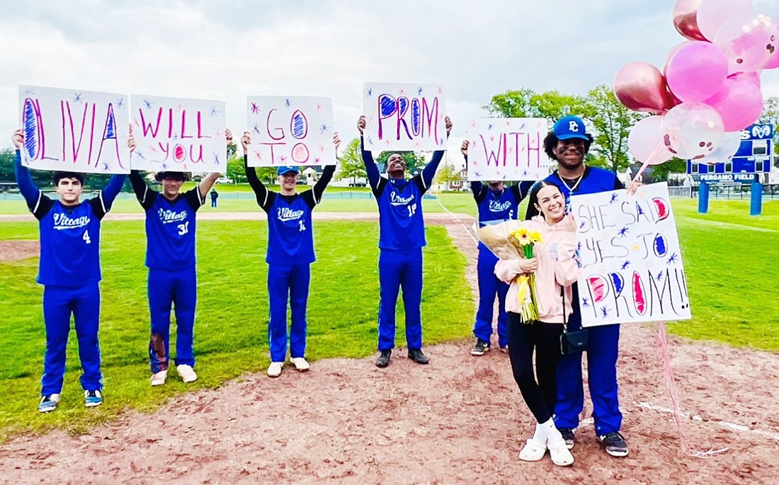 Senior captain of the Port Chester varsity baseball team Joshua Virella asked his friend Olivia Tejeda, captain of the Port Chester cheerleading team, to prom right after the Friday, May 10 home baseball game. They’ve been friends since elementary school and both have 100% Port Chester roots, according to Joshua’s mom, Samantha Virella. Josh got some of his teammates to participate in the prom proposal by holding up posters and a flower that Olivia collected as she made her way to home plate where he was waiting for her with balloons and a bouquet of flowers. And Olivia said “yes”!