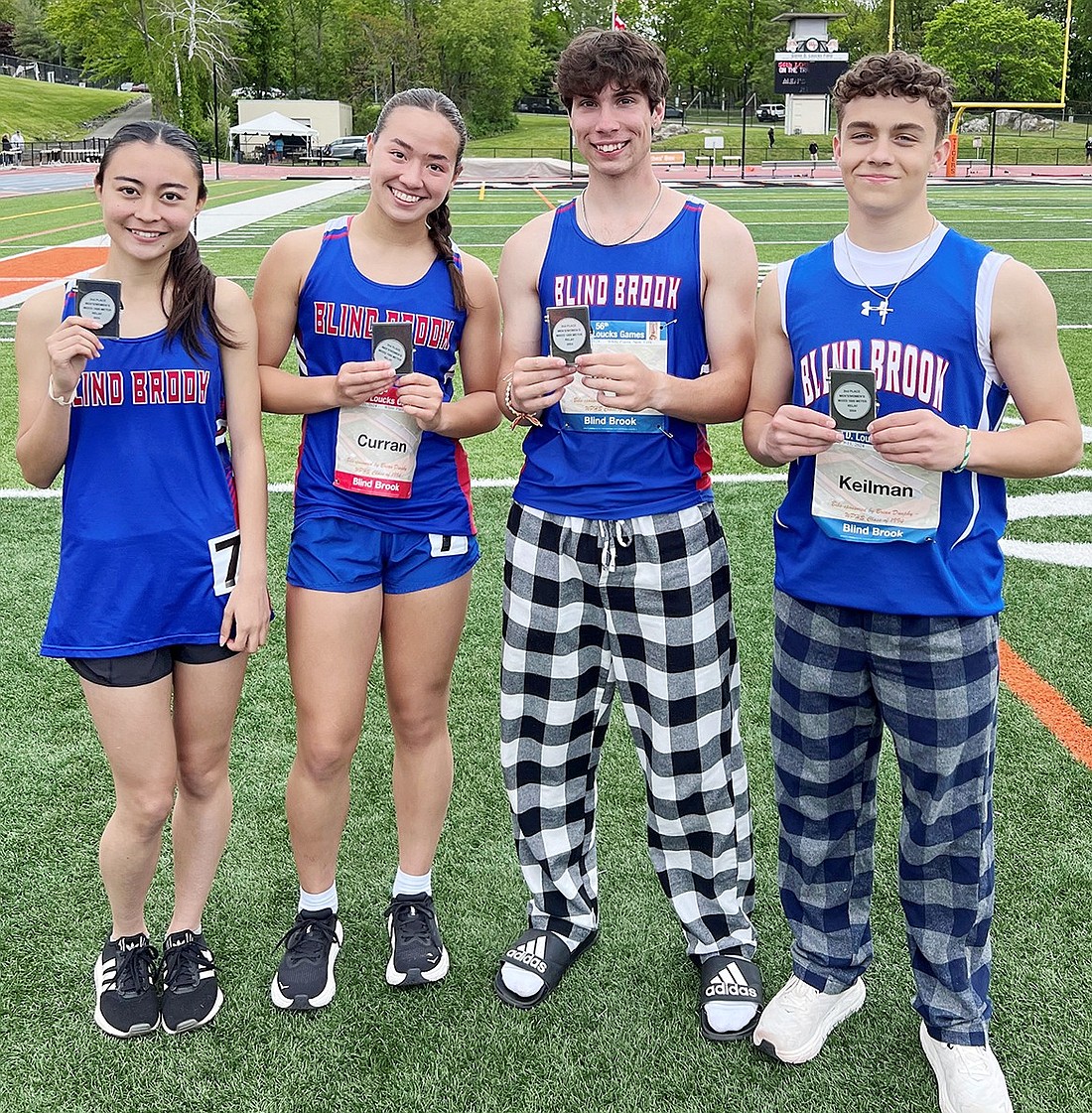 From left: Sena Tarnoff, Kayleigh Curran, Will Jaffee and Danny Keilman took second place in the Mixed "His and Her" 4x400-meter relay in the Loucks Games in White Plains May 11.