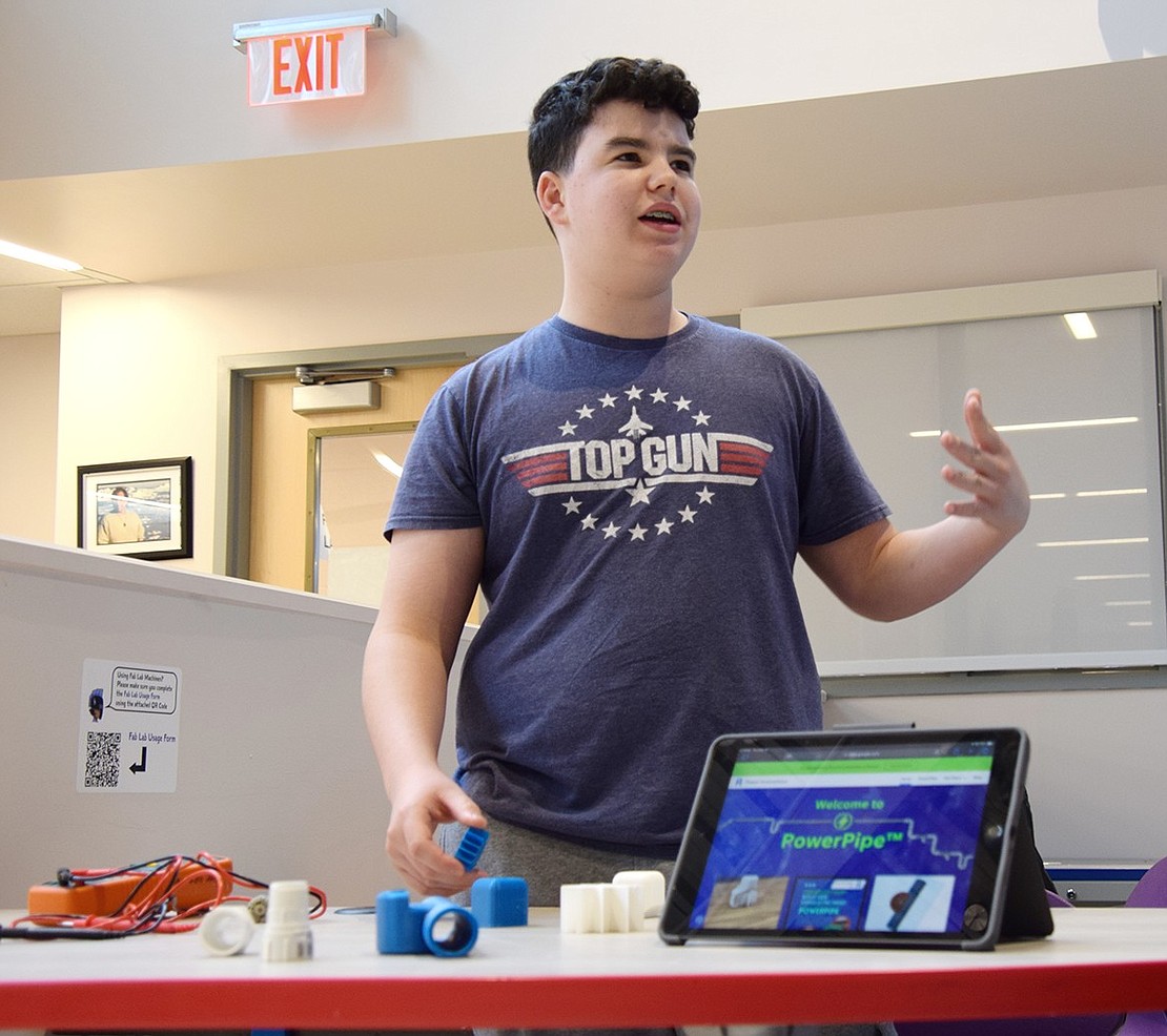 Blind Brook Middle School eighth-grader Andy Montvelisky presents the “Power Pipe” project, which he designed with his classmate Noah Sausen. The system, which the boys created for the Startup Studio class, intends to use the water running through the pipes of a home to generate electricity.