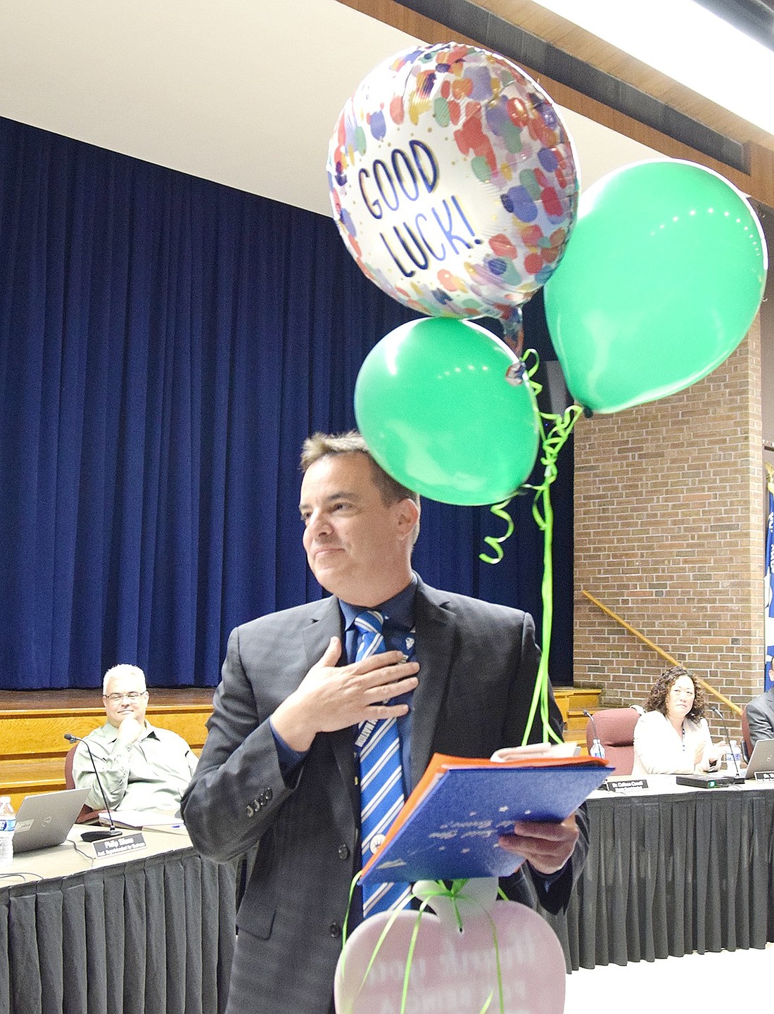 A touched Ivan Tolentino reacts to the farewell he received from his former colleagues at Thomas Edison Elementary School after it was announced he would be leaving the Port Chester School District at the Board of Education meeting on Thursday, May 24.