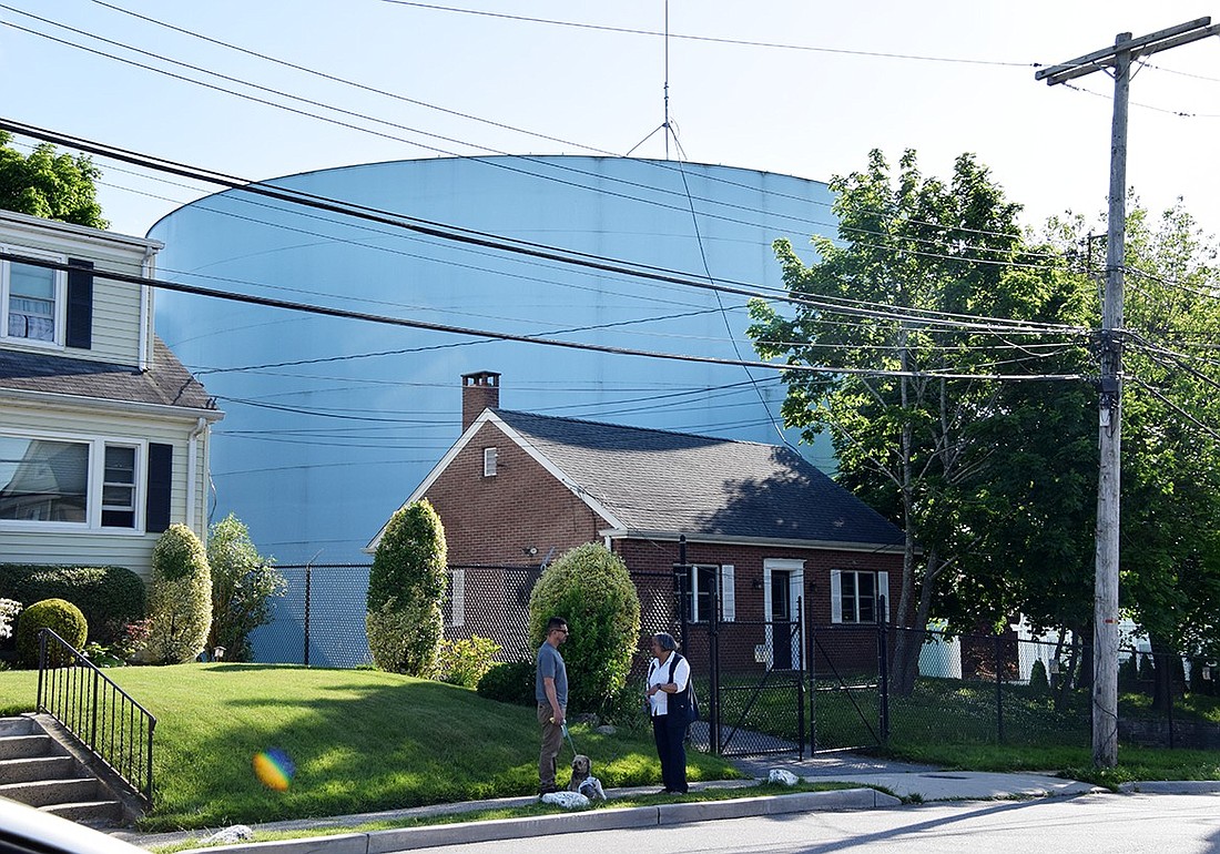 Huge water storage tank on Summit Avenue in Port Chester blends into the neighborhood with the small brick structure resembling a house in front of it.