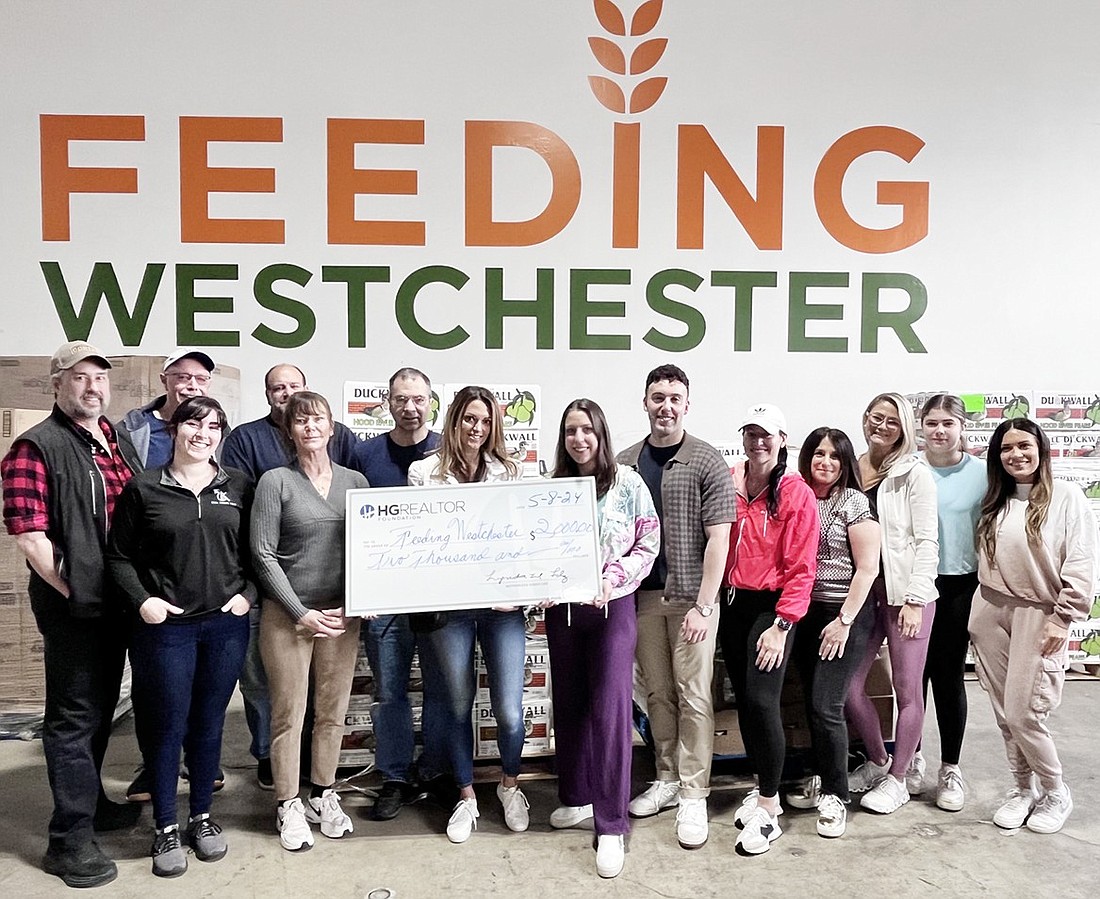 The Hudson Gateway Realtor Foundation recently presented a donation to Feeding Westchester and volunteered with the organization to pack groceries.