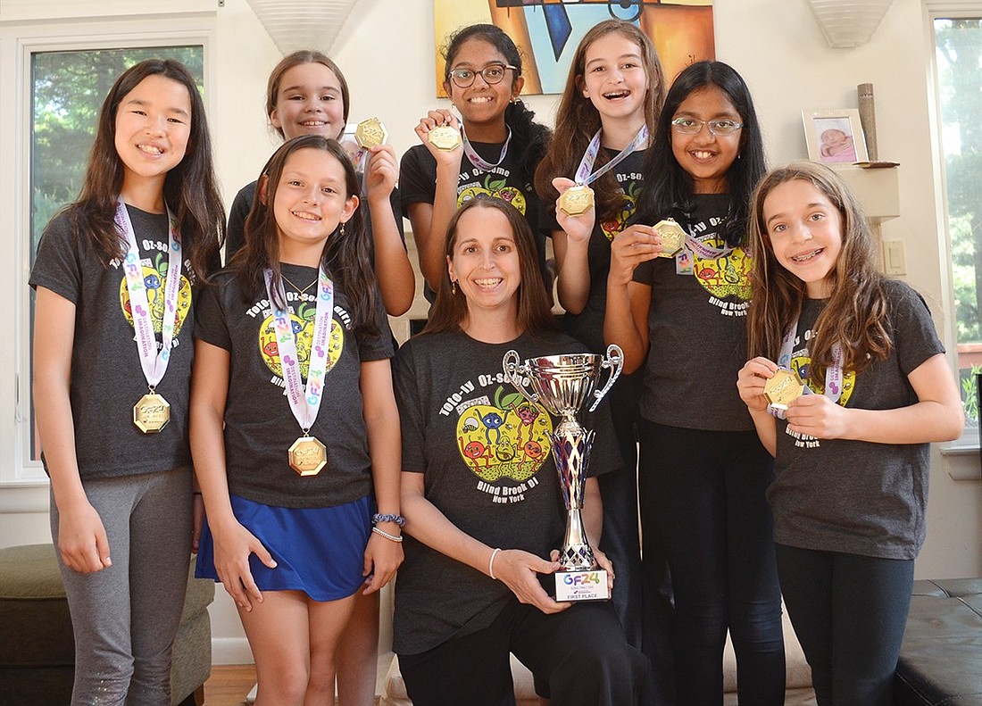 Members of the Toto-ly Oz-some Girls, a fifth-grade Destination Imagination team, pose with first-place medals on Tuesday, June 4, after returning from the 2024 Global Finals competition, a first for any Blind Brook Schools team. Back, from left: Megan Tapper, Bhoomi Dharmashankar and Ellie Tapper. Front: Sakura Murray, Ana Lomenso, parent Erica Tapper, Reha Prathy and Ella Seif.