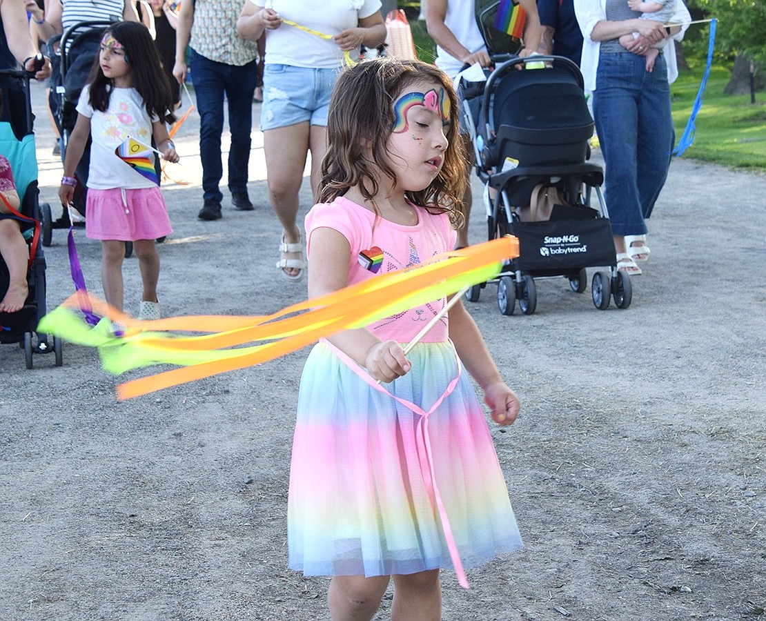 Jordan Vargas, a 3-year-old Port Chester resident, coolly waves streamers during a parade at the annual Pride Festival at Rye Town Park on Saturday, June 1. Hosted by the Town of Rye and pRYEde community group, the event celebrated the start of Pride Month with a flag raising ceremony, arts fair and beach party.