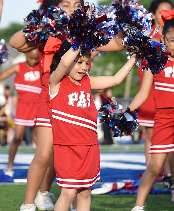 Park Avenue Elementary School first-grader Krystal Mejia can clearly feel the music as she dances with her peers on the spirit squad.