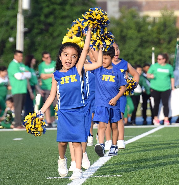 Proudly leading the way onto the Port Chester High School football field with pom-poms in hand, John F. Kennedy kindergartner Isabella Hernandez has no fear as she heads a line of spirit squad members during Band Night on Tuesday, June 4.