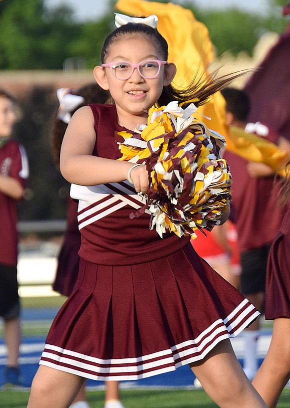 Second-grader Cielo Torres gives it all she’s got while dancing through the King Street School routine.