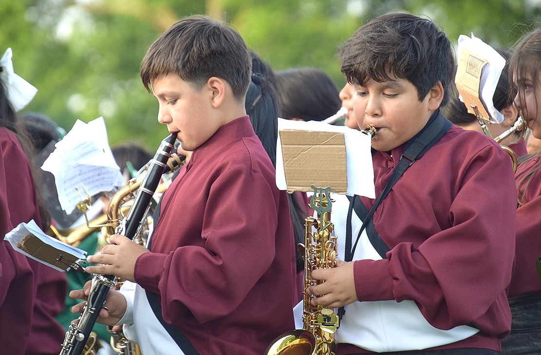 Honing in their woodwind skills early, King Street School fourth-graders Jayden Bautista (left) and Sebastian Martinez are driven to master the clarinet and saxophone.