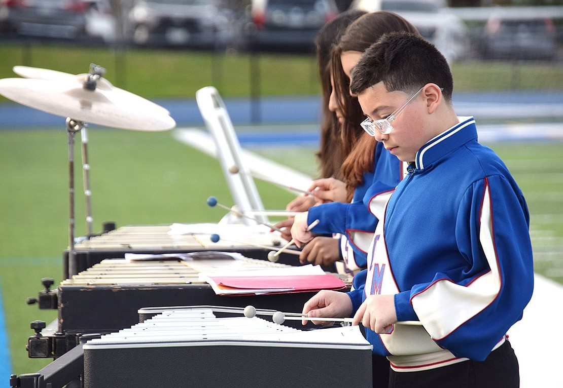 Matthew Navas demonstrates intense focus as he brings rhythm to light on the xylophone with the Port Chester Middle School sixth-grade band.