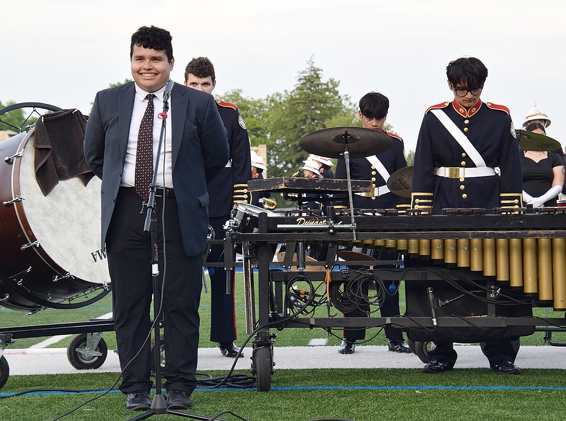 Jordan Rivera, a high school sophomore, joins the Pride of Port Chester to dramatically narrate the theme and message behind their show “New World Symphony.”