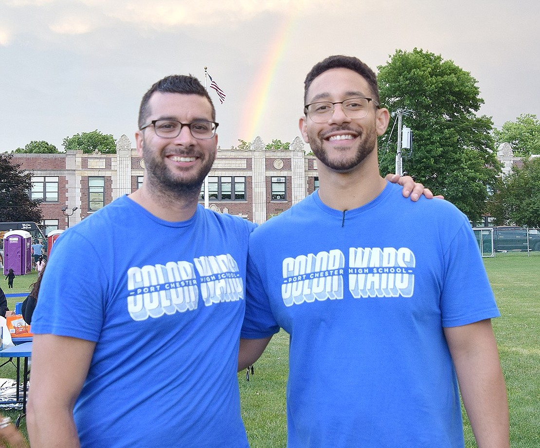 Port Chester High School teachers Michael Stabile and Jeffrey Kravitz, who organized the event, pose for a photo after spotting a rainbow in the sky.